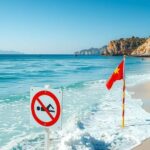 Spiagge in Sardegna con divieti di balneazione e severe condizioni marine.